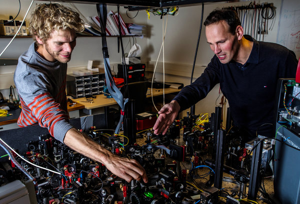Bas Hensen, left, and Ronald Hanson helped show that objects apart can instantly affect each other. Credit Frank Auperle/Delft University of Technology