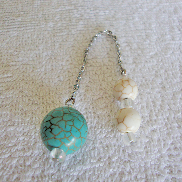 A Natural White & Green Howlite Sandstone Pendulum with Gold Veins