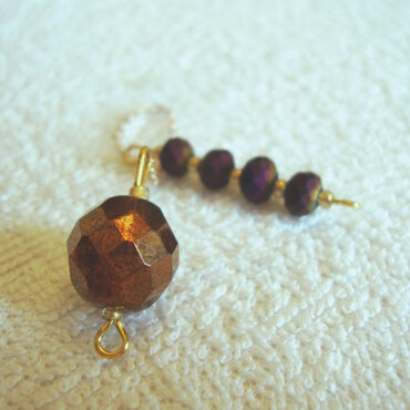 Copper-toned Round Faceted Ball Pendulum with Frosted Multi Tone Handle