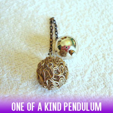 A Copper-tone Hollow Twist Wire Ball Pendulum with a Silver Handle and an antique chain