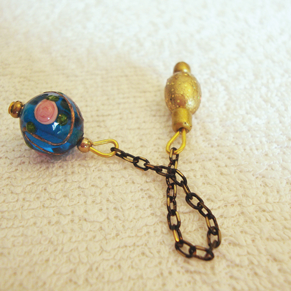 An artisan hand-painted rose Murano Lampwork glass bead ball dowsing pendulum with an antique black-gold chain & a gold oval bead handle