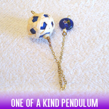 Blue & white round rattan knit acrylic dowsing pendulum with a gold chain and a Millefiori handle