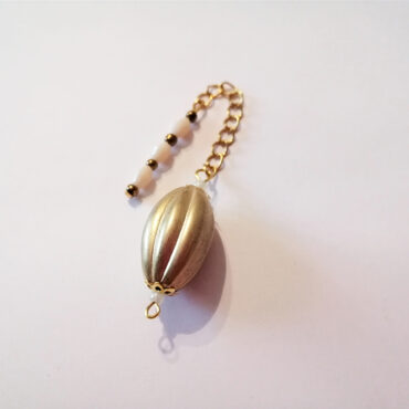 Pumpkin style oval gold bead pendulum on a gold chain with a pink and gold bead handle