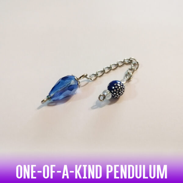 A one-of-a-kind petite drop-shaped dowsing pendulum made with crystal glass faceted beads with silver end caps on an antique silver chain. An acrylic silver studded pattern bead at the handle adds a fancy touch.