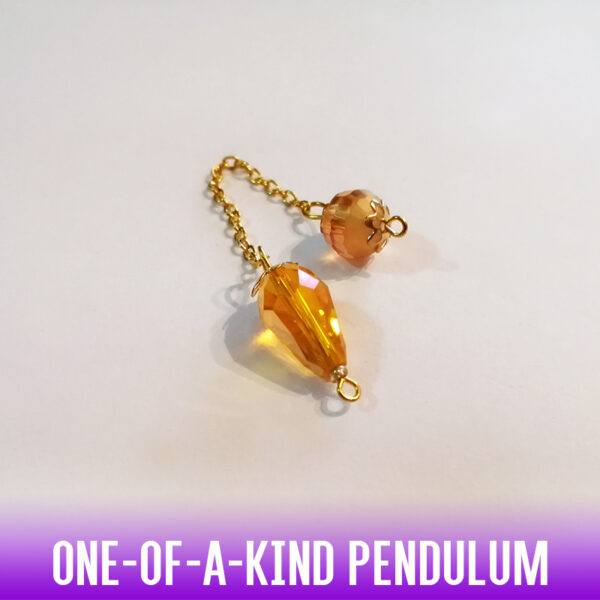 A one-of-a-kind petite drop-shaped dowsing pendulum made with crystal glass faceted beads with gold end caps on an gold chain.