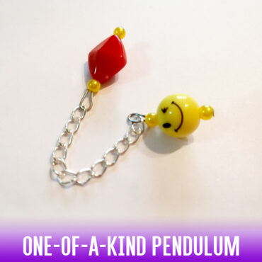 A one-of-a-kind yellow happy face acrylic bead with a red-yellow rhomboid bead handle on a silver chain