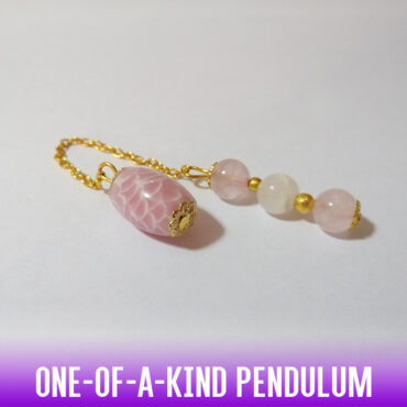 A one-of-a-kind dowsing pendulum made with an oval natural stone pink and white wave bead with an easy-to-hold handle of 3 pink quartz beads on a gold chain. Simply a spectacular tool!