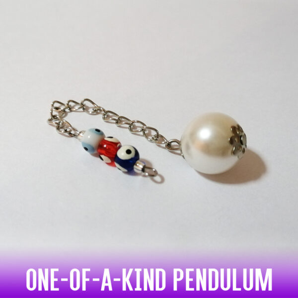 A dowsing pendulum with a round imitation pearl bead and a handle of 3 small and brightly colored "away with evil-eye" beads on a silver chain.
